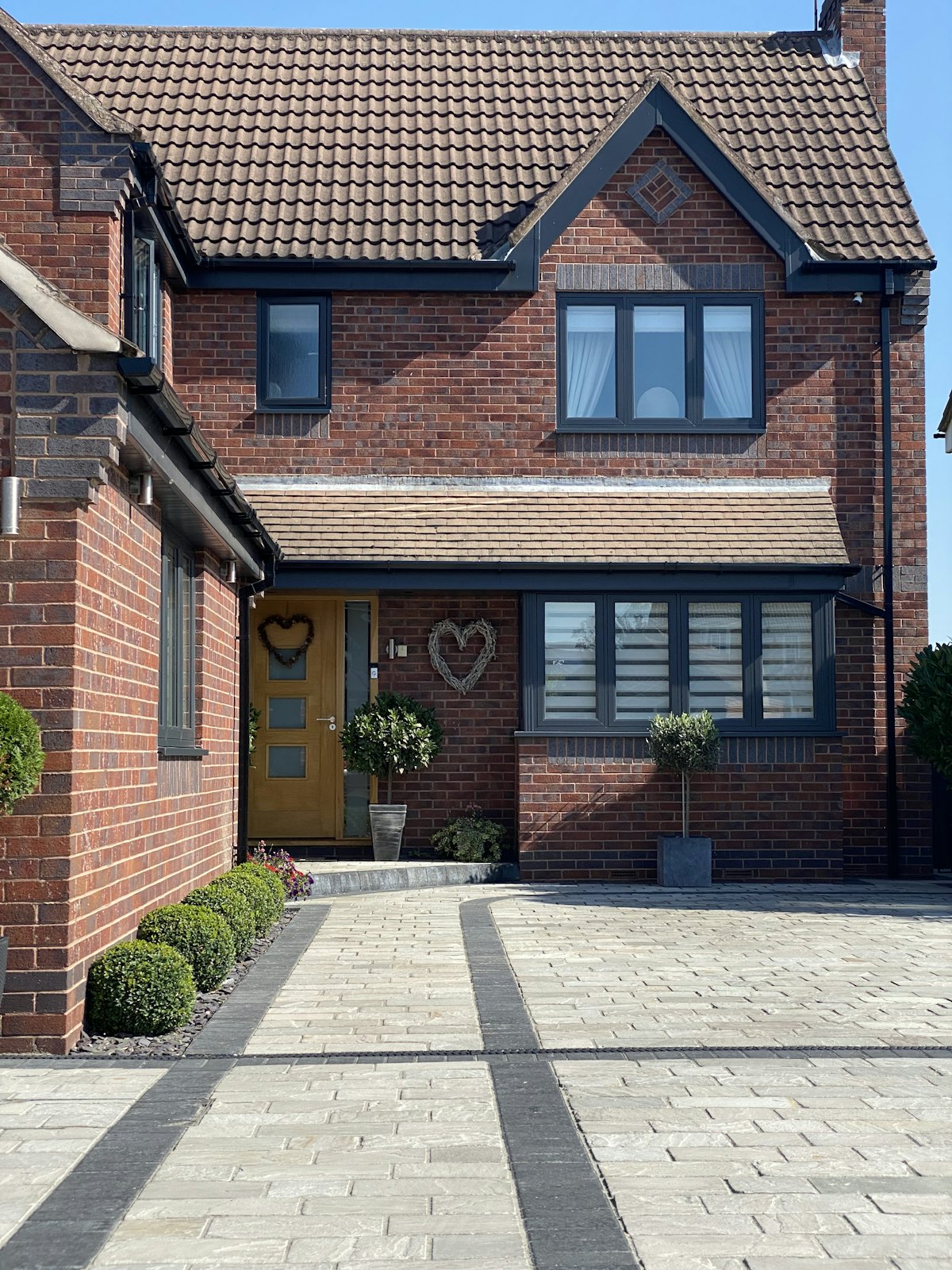 Freshly paved block driveway in front of a home